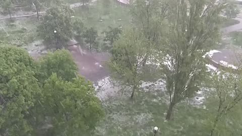 Suddenly it began to rain, and then large hail.