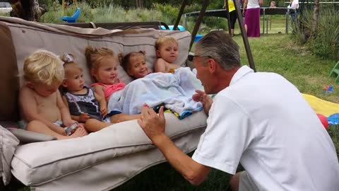 Grandpa entertains all his grandchildren