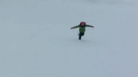 Girl riding alone on a snow rink