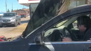 Car Drives with Hood Open