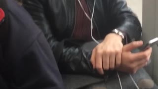 Close up of guy with white headphones on sitting on subway