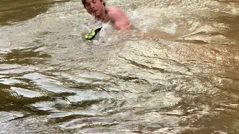 Man Catches Enormous Fish with his Bare Hands