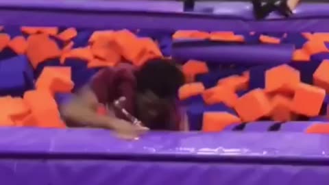 Guy red shirt back flip into purple orange foam fit hits face on floor then blonde girl falls on him