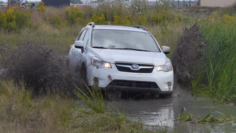 car driving through heavy mud