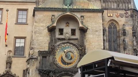 The Orloj (Prague Astronomical Clock) at Noon and Old Town Square in Prague