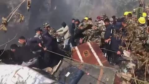 Nepal plane crash: Rescuers search through wreckage