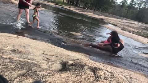 Dad's Quick Reflexes Saves Daughter From Getting Hit After Slipping on Algae-Covered Rocks