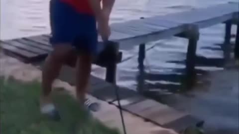Funny street golfer missed his shot and drop down into lake