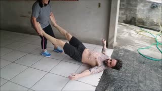 Mom Uses Son as a Squeegee to Wash the Garage