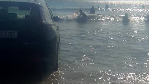 Car Gets Stuck on the Beach