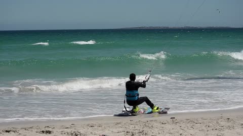 A Man Kite Surfing In The Sea