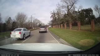 Car Ramps Off Truck's Trailer