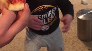 Guaranteed to make you smile ! Baby tries pizza for the first time