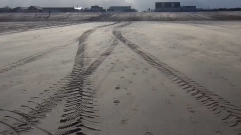 Wind blowing sand all over the beach