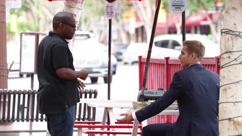 Cash Prank Counting a Pile on Public Place