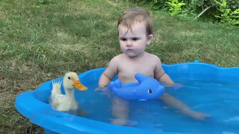 Funny Baby Reaction to Duckling in the Pool@1