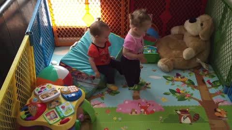 Twin girls play trust game for first time