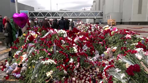 Flower tributes pile up outside Russia concert hall