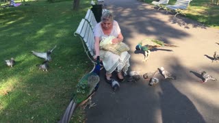 Woman feeding birds