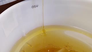 Honey Pouring from Honey Extractor