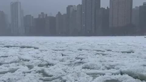 Chicago lake front nearly freezes over during winter storm