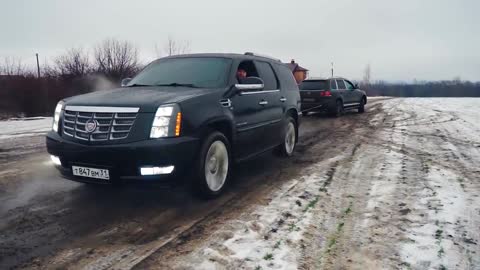 Off Road Cadillac Escalade Goes Up To The Hill Off Road Pulls Touareg