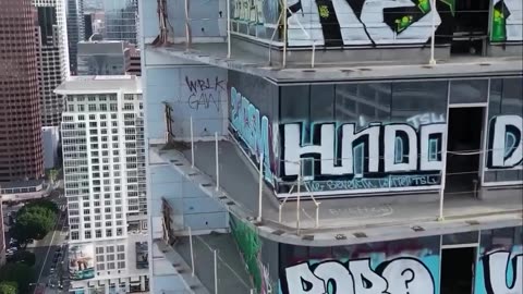 a plan to clean the graffiti off the Oceanwide Plaza towers in downtown Los Angeles. .