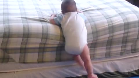 7 month old baby climbs off the bed