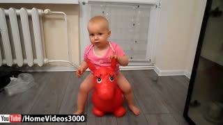 Adorable baby loves her rubber donkey