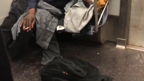 I heart ny man smokes on subway train
