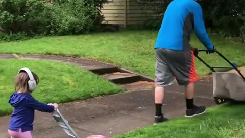 Father And Daughter Take Lawn Mowing Very Seriously