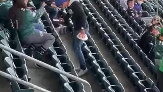 Pigeon Lands on Eagles Fan Shoulder