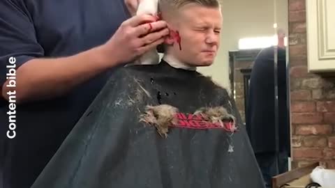 Barber Pranks Kid By Pretending He's Cut His Ear Off