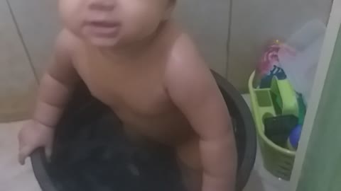 Cute Litte Asian Baby taking a bath