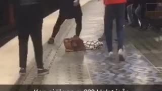 Three guys on subway platform dancing