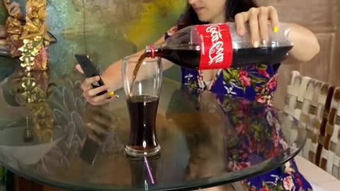 She is drinking all the coca cola