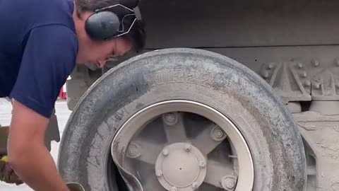 Repair truck with deformed tire of large truck