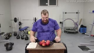 Strong Man Splits Fruit with Single Hand