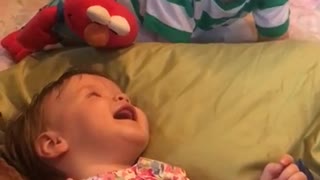 Big brother preciously makes baby sister laugh