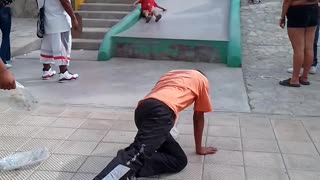 Boy on Slide Accidently Crashes Into Lady