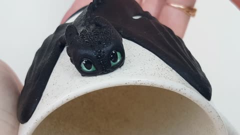 Night Fury Toothless Beamy Eyes from How to Train Your Dragon sit on an Poppy Cream Mug AnneAlArt