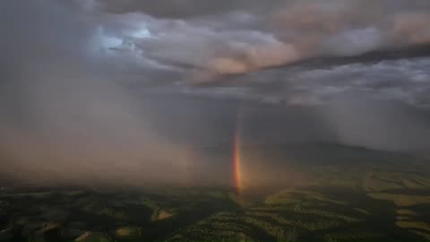 Mavik 3 Pro Capturing a double rainbow inside a distant rain storm along with the sunrise