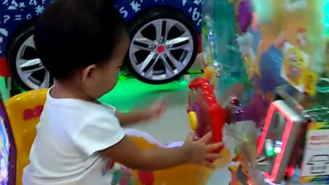 One year old baby show how to use a token