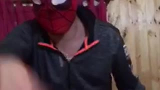 Drunk guy wearing spider man mask falls down