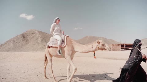 A Woman Riding a Camel