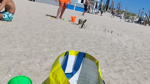 Spencer building a sand castle at the beach VID_20230730_151215