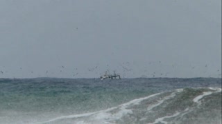 Fishing Boat Sailing on a Stormy Ocean