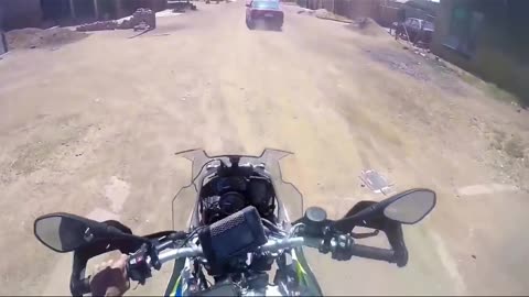South African Cop shoots on car from his motocycle