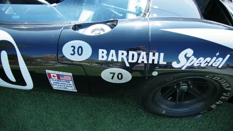 A Vintage Race Car On Display In A Car Show