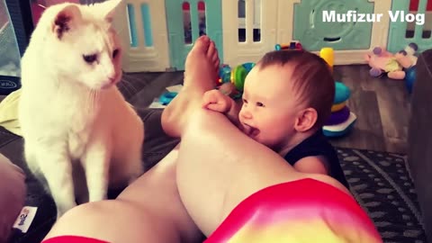 Cute baby with Cute Cat each other do comedy or jokes